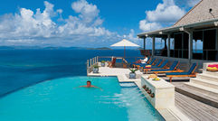 The pool area at the five-bedroom Katitche Point Greathouse on Virgin Gorda is the center of guest activity.