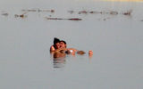 The waters of the Dead Sea are so rich in salt that swimmers naturally bob on its surface.