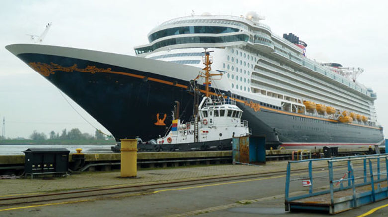 Despite overcast skies and a steady drizzle, thousands of onlookers flocked to the banks of the River Ems in Papenburg, Germany, to witness the float out of the Disney Dream.