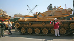 Travel Weekly's Michelle Baran was in Egypt for one week following the country's 18-day revolution, which prompted the evacuation of hundreds of U.S. citizens out of the country last month. Pictured here, a tourist poses in front of one of the tanks stationed at the entrance to the Egyptian Museum.