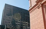 The Egyptian Museum, foreground, and the remains of the National Democratic Party headquarters.