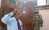 An employee of Big Five Tours & Expeditions leaves an Edfu polling station after voting on a constitutional referendum.