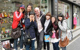 Friendly Seoul schoolgirls mug for the camera after co-opting this reporter into an on-camera karaoke session.