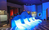 Colorful rooms and illuminated benches stand out at the hydrotherapy area.