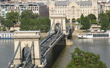 Budapest's famous Chain Bridge. The steeples of St. Stephen's Basilica are visible in the background.