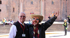 Members of Tourism Cares traveled to Peru in May for its first Global Outreach program. The group met with members of Peru's travel industry in Cuzco, followed by a day in the Inca Sacred Valley, a visit to Machu Picchu and a restoration project back in Cuzco. Pictured here, Bruce Beckham, CEO of Tourism Cares, and the rest of the visiting Americans were greeted in Cuzco by a troupe of costumed entertainers. Photos by Arnie Weissmann
