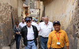 Lima Tours guide Ernesto Ore leads George Washington University professor Don Hawkins, center, Avanti Destinations president Harry Dalgaard, right, and other Tourism Cares members on a tour of Ollantaytambo.