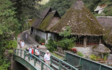 After lunch at the Inkaterra Cafe (building in background) Tourism Cares members begin the walk through Agua Callientes to coaches bound for Machu Picchu.