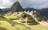 The first view of Machu Picchu was dramatic, lit by late afternoon sun and ringed by fog.