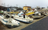 A salvage yard of boats damaged in the tsunami. Photo by Arnie Weissmann