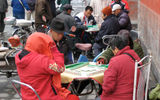 Older Beijing residents play mahjong in one of the city's hutongs, or traditional residential districts.