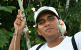 George Davila, the naturalist guide on International Expeditions' La Amatista, with his piranha catch.