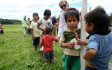 Handing out school supplies to local river children.