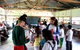 The group visited a local school, met the students and dropped off supplies.