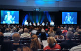 Audience members listened to a discussion about "the future of the travel agent."