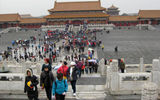 Even in the off-season, tourists crowd Beijing's Forbidden City.