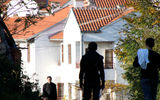 Residents walk along the roads in the hills above Kosovo’s divided city of Mitrovica. These houses are on the Serbian side of town.