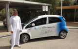 In partnership with MIT, Abu Dhabi is creating what is meant to be the "greenest" habitat in the world, Masdar City, with the goal of carbon neutrality. All materials used in its construction are fabricated to have the least impact on the environment. Pictured here, Omar Mohammed Al Busaidy, senior tourism and corp planning analyst for the Abu Dhabi Tourism & Culture Authority, with a solar-powered car for transportation within the complex.
