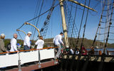 Terry Dale, president of the U.S. Tour Operators Association (second from left), boarding the Joseph Conrad, a ship built in 1882.