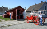 Volunteers paint and do much-needed maintenance work on the re-created 19th century village.