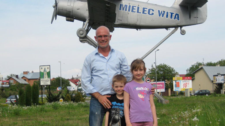 Travel Weekly's Kenneth Kiesnoski and family members recently visited Poland on a heritage trip. With cousins Michael and Veronica Wyparlo at the unique "Welcome to Mielec" sign at the edge Mielec, home to a Sikorsky aircraft plant.