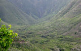 Visitors can join guided hikes into Halawa Valley that travel to the distant waterfall visible in this image. Hawaiian stories, lessons about plants and animals and a chance to swim in the waterfall's pool are all part of the trip.