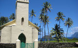 After his death in 1889, Saint Damien was buried next to St. Philomena's Catholic Church, seen here near Kalawao on the eastern coast of the Kalaupapa peninsula. Only his right hand remains interred at this site today, with the rest of his remains buried in Leuven, Belgium, near the village where he was born.