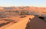 The land of sand and big game has drawn kudos and controversy with its pursuit of an independent approach to wildlife management that challenges both travelers and the industry to reassess what it means to be a responsible tourist. Shown here, Heidi Huettmann of Stutgart, Germany, and her husband Helmut, climb the Big Mama sand dune in the Sossusvlei section of Namib-Naukluft National Park. Photos by Arnie Weissmann
