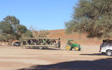 Tractor pull: Visitors without four-wheel vehicles are brought into the dunes of Sossusvlei on tractor-pulled trailers.