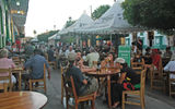 A restaurant-lined pedestrian street draws Granada's tourists each evening.