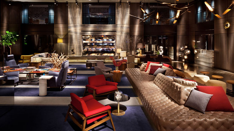 Take a tour through Manhattan's disparate districts, and you'll encounter a dizzying array of architectural, social and cultural contradictions found in few other U.S. cities. Many of those contradictions are mirrored in the borough's newer -- or, in some cases, reimagined -- design-oriented hotels. Pictured here, the two-story "living room" lobby at the Paramount Hotel.