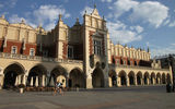 A cyclist crosses in front of the Cloth Hall, at the center of Krakow's Market Square. The building, now housing small shops, recalls the city's importance as a medieval trading center, when Krakow also was Poland's capital.