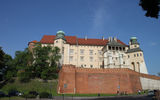 The hilltop Wawel Castle, once home to Polish royalty. The figures in the foreground indicate the scale of the retaining walls.