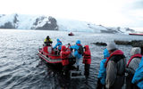 Hurtigruten Fram passengers boarding a Polar Cirkel boat at a stop in Antarctica.