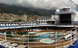 The Riviera's pool deck, with Monaco's Port Hercules in the background.