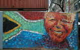 A mural of former South African president Nelson Mandela on a pedestrian street in downtown Cape Town is made entirely of handprints.