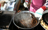 Silkworm larvae bubbling in a kettle.