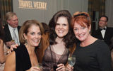 Christine Stevens, left, and Susan Prinzing, center, both of Holland America Line and Seabourn Cruise Line, get the party started with Katie Gerhard of Carnival Cruise Lines.