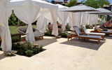 Poolside cabanas offer a shady retreat from Grenada's sunshine; the swim-up bar is just a few strokes away as well.