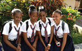 Schoolgirls in uniforms crowd Market Square when classes are dismissed each day.