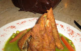 A Mexican specialty called rollos with huitlacoche (fried tortillas with pumpkin flower and corn fungus).