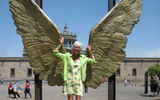 Travel Weekly's Mexico Editor Gay Nagle Myers poses in front of a winged bronze statue near Guadalajara's Cultural Institute.