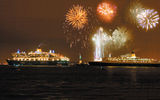 The debut of Cunard's Queen Mary 2 prompted celebrations wherever the ship went; it met with the Queen Elizabeth 2 in New York.