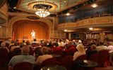 A "riverlorian" gives a lecture on the Mississippi River System in the Grand Saloon.