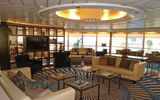 Windstar Cruises has begun sailing the former Seabourn Pride under a new name, Star Pride. After an 18-day drydock, Windstar put its own stamp on a number of public spaces. The former Constellation Lounge is now the Yacht Club (pictured here), and Windstar has installed its trademark Compass Rose lounge where The Club used to be. Windstar is playing up the yacht-like feel of the Star Pride, the first of its ships that won't have sails. See more of the changes in the following slides. TW photos by Tom Stieghorst; posted May 22, 2014
