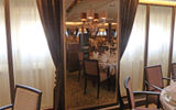 As in other Windstar ships, a full-length mirrored panel with sconces decorates the space between windows in the Amphora restaurant. The Seabourn Pride had drapes between windows.