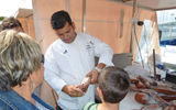 Star Pride executive chef Rohit Dimri explaining how he checks fish for freshness at one of the seafood vendors that line the harbor in Sanary-Sur-Mer.