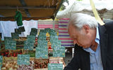 Shopping for tomatoes at the market.