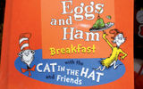 Carnival Cruise Lines' new partnership with Dr. Seuss Enterprises brings Seuss characters and stories to life on its ships. The Seuss program, which has been on the Carnival Freedom for about a month, includes a character breakfast that revolves around the Seuss story ''Green Eggs & Ham.'' Main character Sam I Am is joined at the breakfast by characters from Seuss's ''Cat In the Hat,'' including the namesake cat and his helpers, Thing One and Thing Two. Also onboard is a Seuss character parade. TW photos by Tom Stieghorst; posted July 7, 2014