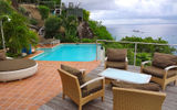 The pool and sitting area at L'enclos villa.